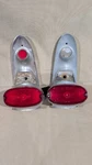 Oem 1957 Pontiac Tail Light Assemblys (pair) GUIDE-R2-57 C25-9 Lenses Included. Fixed Price $399.95.