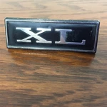Nos Ford D0AZ-6204460-A 1970 Xl Dash Emblem Nameplate. Fixed Price $270.00.