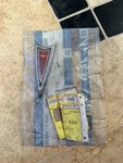 1982-1991 Pontiac Headlamp & Radiator Grille Mount Panel Emblem Gm Nos 20416354. Fixed Price $60.00.