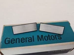 Nos 1974-78 Chevy Cadillac Olds Door Assist Strap Escutcheon Cover Pair 1653249. Fixed Price $15.00.