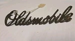 Oem 68 69 70 Oldsmobile Grill Hood Script Nameplate 399094. Fixed Price $34.95.