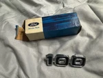 Nos 1975 1979 Ford E100 Door Emblem "100" D5UZ-1125622-A. Fixed Price $40.00.