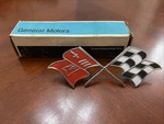 1957-1960 Corvette: Nos Crossed Flags Emblem Badge #3767507 With Gm Box. Fixed Price $70.00.