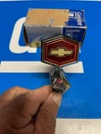 Nos 80 87 Chevy Malibu Hood Ornament Header Emblem 14011341. Fixed Price $129.00.