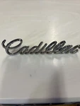 1974 - 1975 Cadillac Deville Front Header Script Nameplate Emblem #9834648. Fixed Price $34.99.