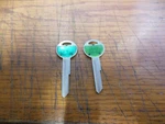2 Cole Y149 Key Blanks (green Top). Fixed Price $6.00.
