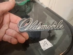 Vintage Oldsmobile Grille Emblem Script Oem Gm 414335. Fixed Price $23.99.