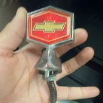 Nos 80 87 Chevy Malibu Hood Ornament Header Emblem 14011341. Fixed Price $85.00.
