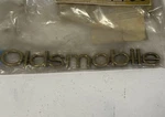 1999-2004 Oldsmobile Gold Emblem Nameplate Oem #10342809 Gm New Genuine. Fixed Price $20.00.